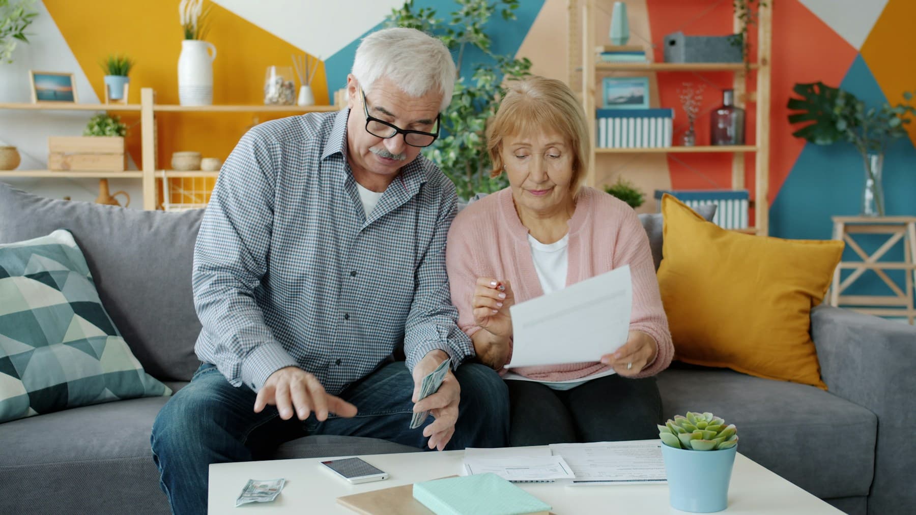 An older couple reviewing documents together at home